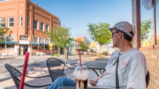 Savoring the moment from a sidewalk cafe
